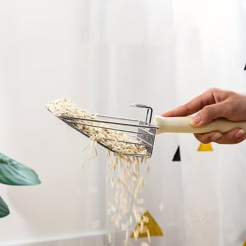 Image of cat litter falling through 2 in 1 Metal Litter Scoop - Pets Villa. 