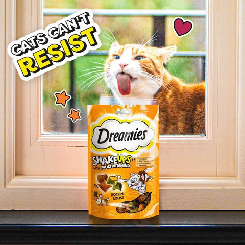 Image of a cat licking window for DREAMIES ShakeUps Rockin Roost 55g - Pets Villa. 